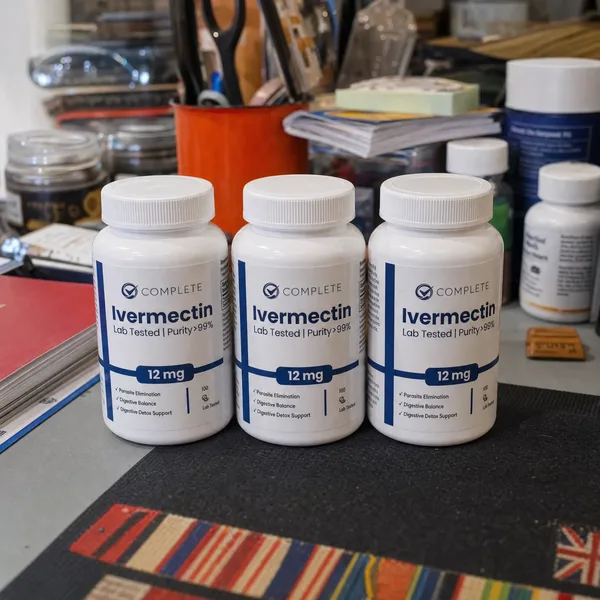 Three bottles of Complete Supplements Ivermectin on a workbench