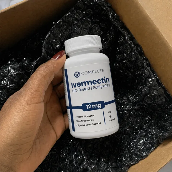 Customer holding a bottle of Complete Supplements Ivermectin over bubble wrap